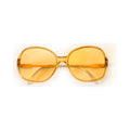 AMBER Sunglasses - oversized translucent honey frame with golden lenses, front view