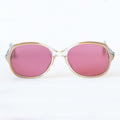 BLUSH Sunglasses - translucent champagne oversized frame with berry rose lenses, front view