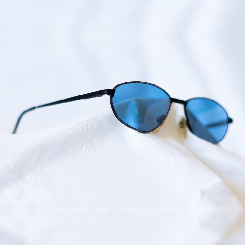 PRISM Sunglasses - lifestyle angled view on white fabric