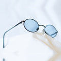 ORBIT Sunglasses - thin black metal oval frame with ice blue lenses